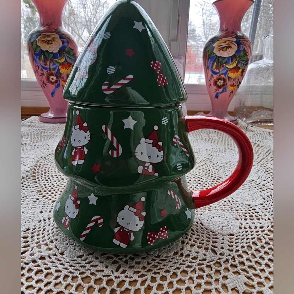 This is a Hello Kitty Christmas tree-shaped mug. Used